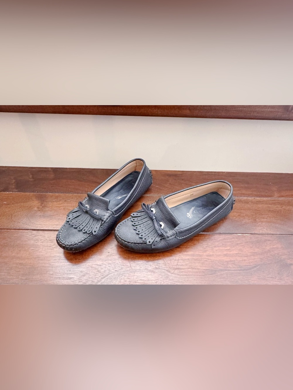 Tod’s Black Leather Fringe Kiltie Moccasin Loafers